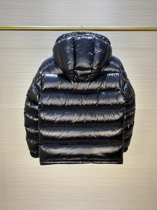 Men's Maya Puffet Jacket by M*ncler featuring a padded, stylish design in black, displayed on a model.