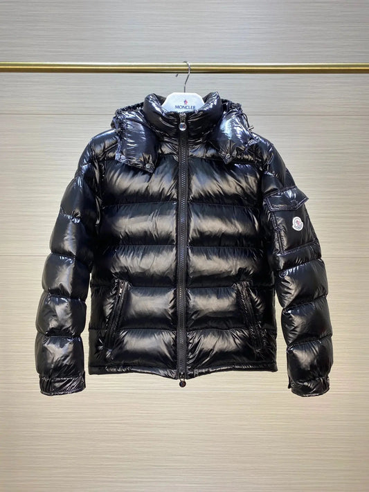 Men's Maya Puffet Jacket by M*ncler featuring a padded design, standing collar, and stylish fit in a sleek black color.